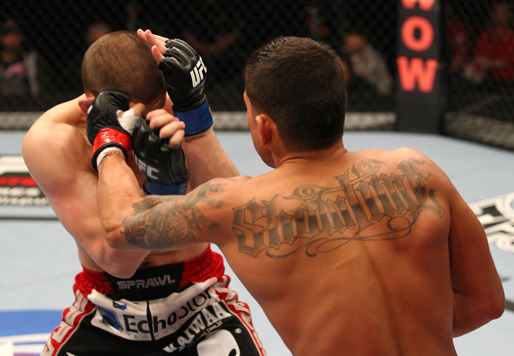 SAITAMA, JAPAN - FEBRUARY 26:  (R-L) Anthony Pettis punches Joe Lauzon during the UFC 144 event at Saitama Super Arena on February 26, 2012 in Saitama, Japan.  (Photo by Al Bello/Zuffa LLC/Zuffa LLC via Getty Images) *** Local Caption *** Anthony Pettis; Joe Lauzon