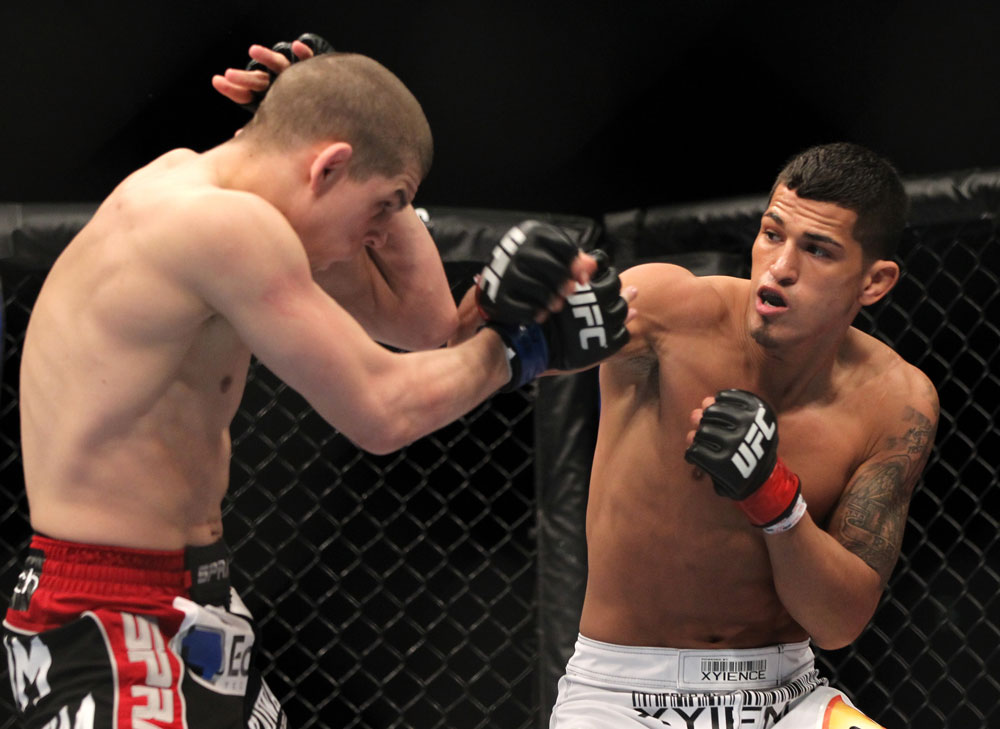 SAITAMA, JAPAN - FEBRUARY 26:  (R-L) Anthony Pettis punches Joe Lauzon during the UFC 144 event at Saitama Super Arena on February 26, 2012 in Saitama, Japan.  (Photo by Josh Hedges/Zuffa LLC/Zuffa LLC via Getty Images) *** Local Caption *** Anthony Pettis; Joe Lauzon