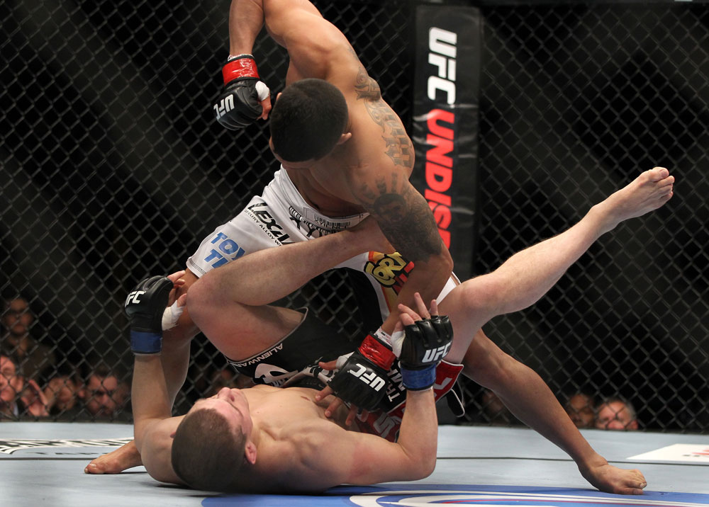 SAITAMA, JAPAN - FEBRUARY 26:  (R-L) Anthony Pettis knocks out Joe Lauzon during the UFC 144 event at Saitama Super Arena on February 26, 2012 in Saitama, Japan.  (Photo by Josh Hedges/Zuffa LLC/Zuffa LLC via Getty Images) *** Local Caption *** Anthony Pettis; Joe Lauzon