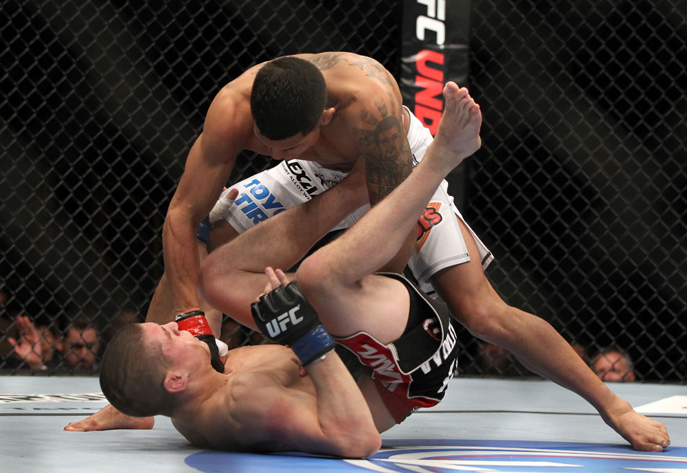 SAITAMA, JAPAN - FEBRUARY 26:  (R-L) Anthony Pettis knocks out Joe Lauzon during the UFC 144 event at Saitama Super Arena on February 26, 2012 in Saitama, Japan.  (Photo by Josh Hedges/Zuffa LLC/Zuffa LLC via Getty Images) *** Local Caption *** Anthony Pettis; Joe Lauzon