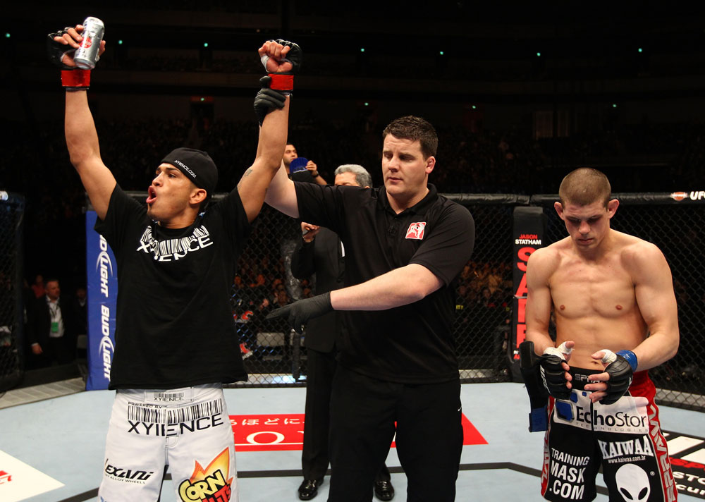 SAITAMA, JAPAN - FEBRUARY 26:  Anthony Pettis (L) reacts after knocking out Joe Lauzon during the UFC 144 event at Saitama Super Arena on February 26, 2012 in Saitama, Japan.  (Photo by Al Bello/Zuffa LLC/Zuffa LLC via Getty Images) *** Local Caption *** Anthony Pettis; Joe Lauzon