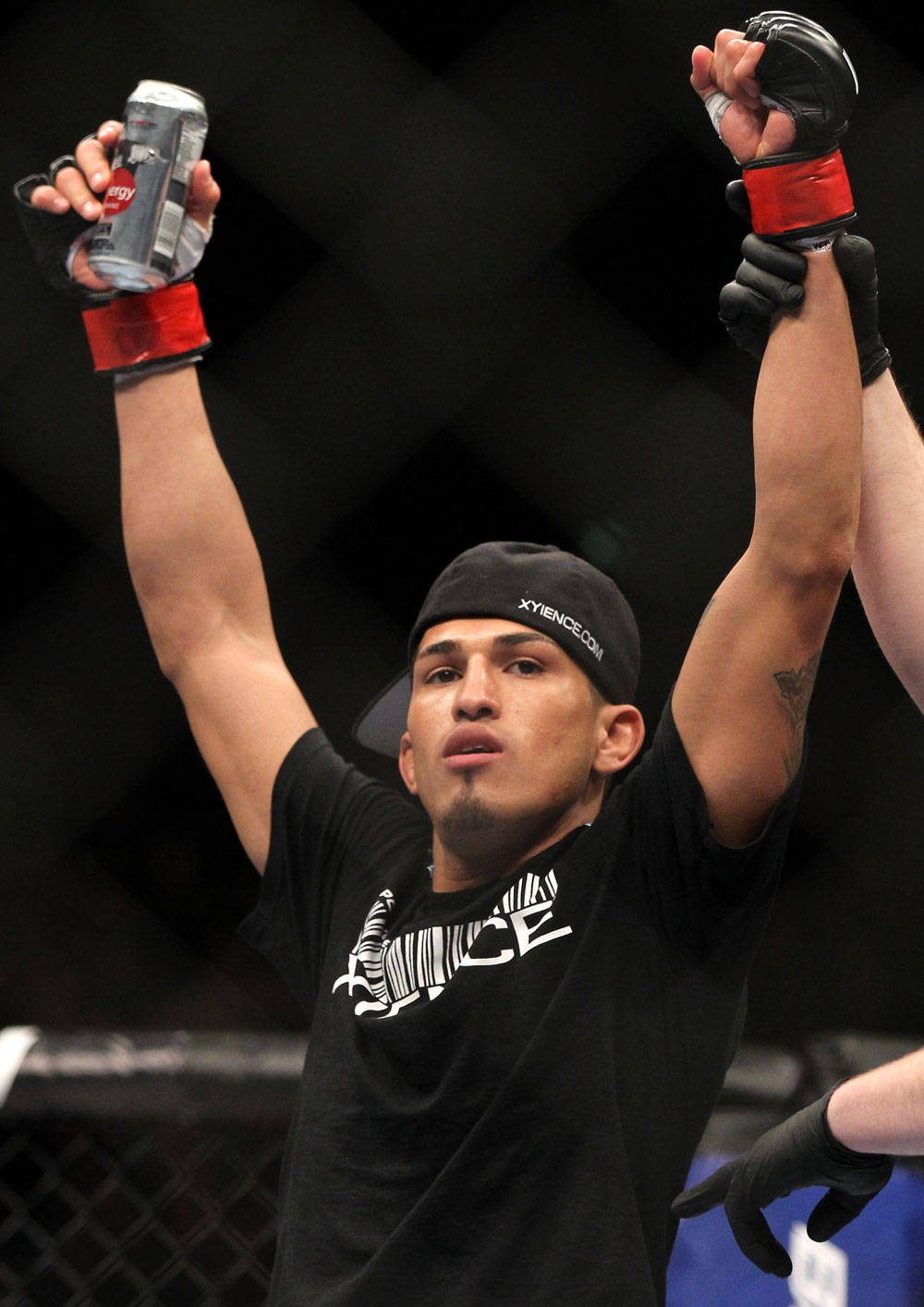 SAITAMA, JAPAN - FEBRUARY 26:  Anthony Pettis reacts after knocking out Joe Lauzon during the UFC 144 event at Saitama Super Arena on February 26, 2012 in Saitama, Japan.  (Photo by Josh Hedges/Zuffa LLC/Zuffa LLC via Getty Images) *** Local Caption *** Anthony Pettis