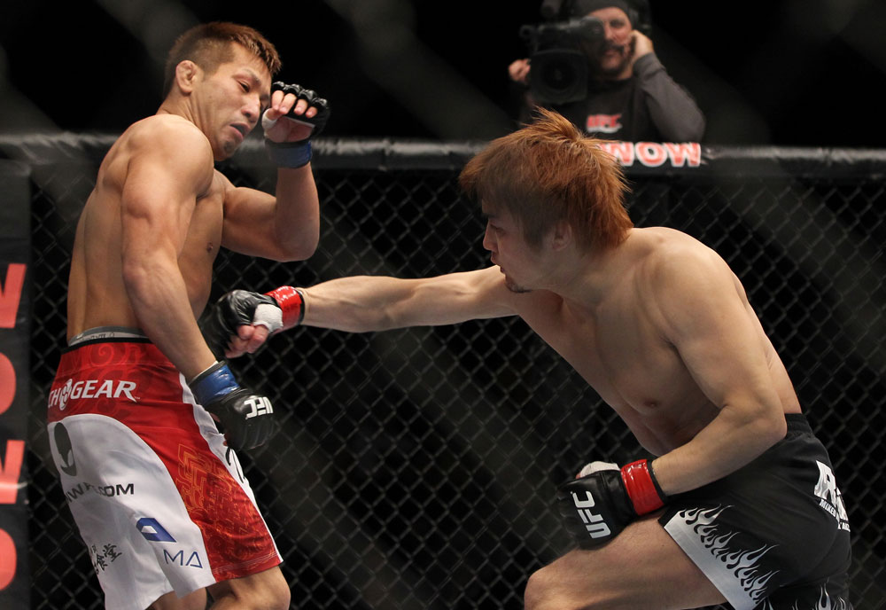 SAITAMA, JAPAN - FEBRUARY 26:  (R-L) Takanori Gomi punches Eiji Mitsuoka during the UFC 144 event at Saitama Super Arena on February 26, 2012 in Saitama, Japan.  (Photo by Josh Hedges/Zuffa LLC/Zuffa LLC via Getty Images) *** Local Caption *** Takanori Gomi; Eiji Mitsuoka
