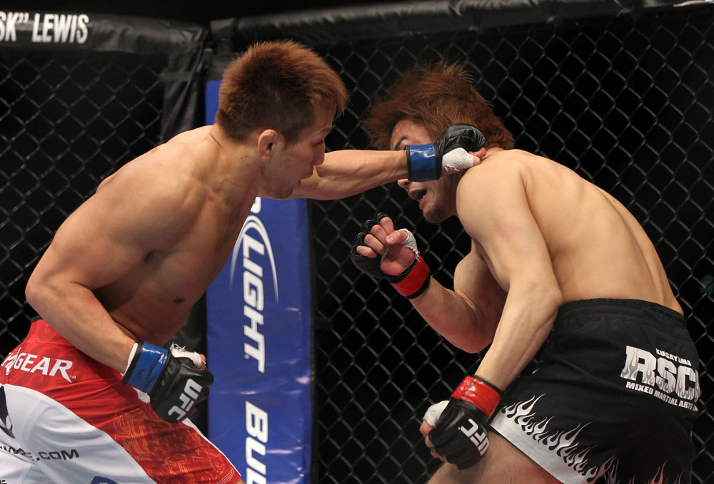 SAITAMA, JAPAN - FEBRUARY 26:  (L-R) Eiji Mitsuoka punches Takanori Gomi during the UFC 144 event at Saitama Super Arena on February 26, 2012 in Saitama, Japan.  (Photo by Josh Hedges/Zuffa LLC/Zuffa LLC via Getty Images) *** Local Caption *** Takanori Gomi; Eiji Mitsuoka