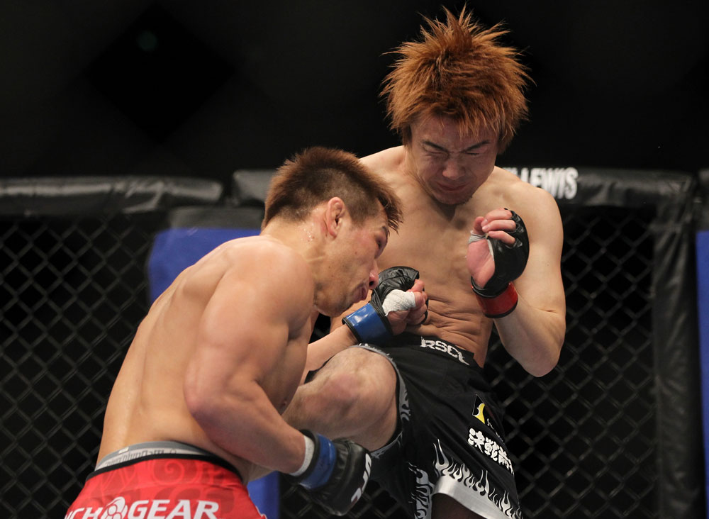 SAITAMA, JAPAN - FEBRUARY 26:  (R-L) Takanori Gomi and Eiji Mitsuoka trade strikes during the UFC 144 event at Saitama Super Arena on February 26, 2012 in Saitama, Japan.  (Photo by Josh Hedges/Zuffa LLC/Zuffa LLC via Getty Images) *** Local Caption *** Takanori Gomi; Eiji Mitsuoka