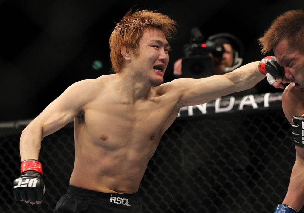 SAITAMA, JAPAN - FEBRUARY 26:  (L-R) Takanori Gomi punches Eiji Mitsuoka during the UFC 144 event at Saitama Super Arena on February 26, 2012 in Saitama, Japan.  (Photo by Josh Hedges/Zuffa LLC/Zuffa LLC via Getty Images) *** Local Caption *** Takanori Gomi; Eiji Mitsuoka