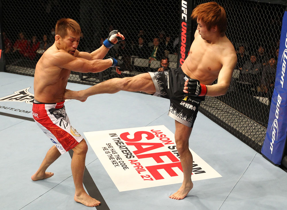 SAITAMA, JAPAN - FEBRUARY 26:  (R-L) Takanori Gomi kicks Eiji Mitsuoka during the UFC 144 event at Saitama Super Arena on February 26, 2012 in Saitama, Japan.  (Photo by Al Bello/Zuffa LLC/Zuffa LLC via Getty Images) *** Local Caption *** Takanori Gomi; Eiji Mitsuoka