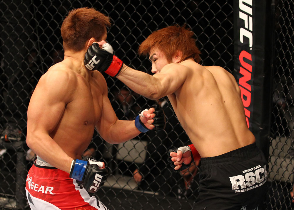 SAITAMA, JAPAN - FEBRUARY 26:  (R-L) Takanori Gomi punches Eiji Mitsuoka during the UFC 144 event at Saitama Super Arena on February 26, 2012 in Saitama, Japan.  (Photo by Al Bello/Zuffa LLC/Zuffa LLC via Getty Images) *** Local Caption *** Takanori Gomi; Eiji Mitsuoka