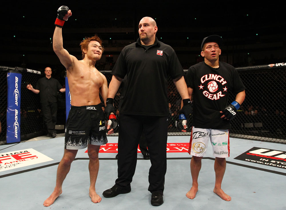 SAITAMA, JAPAN - FEBRUARY 26:  Takanori Gomi (L) reacts after defeating Eiji Mitsuoka by TKO during the UFC 144 event at Saitama Super Arena on February 26, 2012 in Saitama, Japan.  (Photo by Al Bello/Zuffa LLC/Zuffa LLC via Getty Images) *** Local Caption *** Takanori Gomi; Eiji Mitsuoka