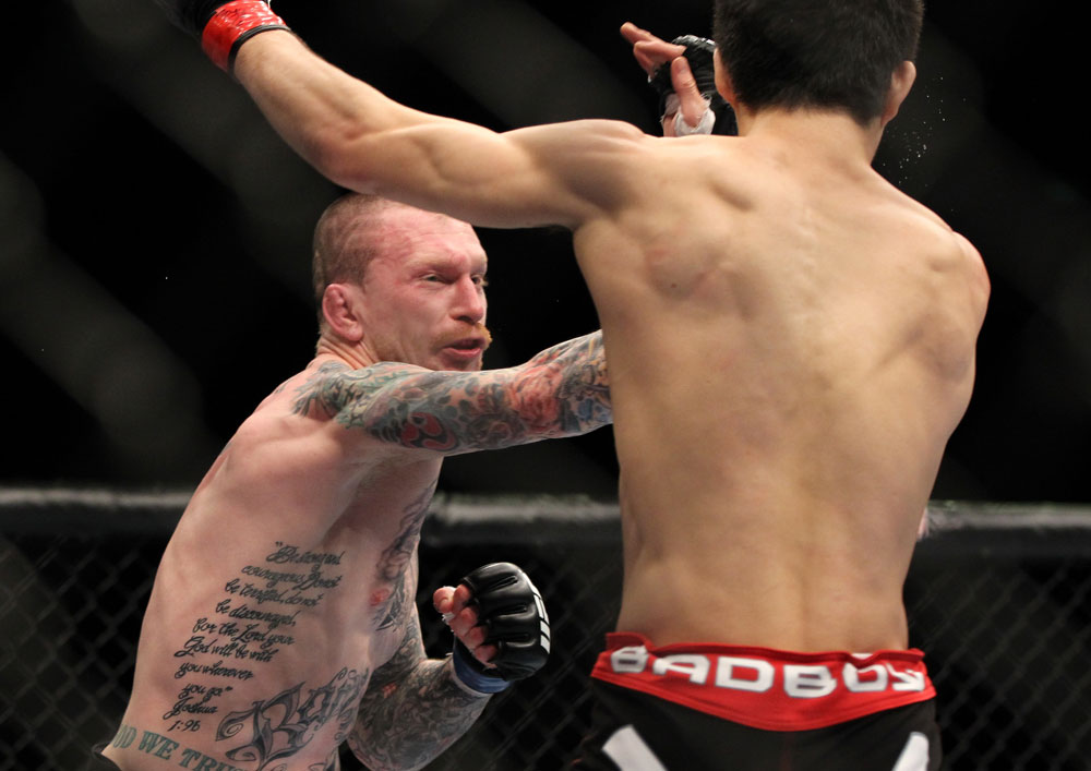 SAITAMA, JAPAN - FEBRUARY 26:  (L-R) Bart Palaszewski punches Hatsu Hioki during the UFC 144 event at Saitama Super Arena on February 26, 2012 in Saitama, Japan.  (Photo by Josh Hedges/Zuffa LLC/Zuffa LLC via Getty Images) *** Local Caption *** Hatsu Hioki; Bart Palaszewski
