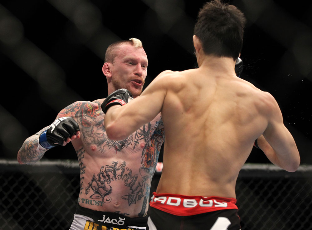 SAITAMA, JAPAN - FEBRUARY 26:  (L-R) Bart Palaszewski punches Hatsu Hioki during the UFC 144 event at Saitama Super Arena on February 26, 2012 in Saitama, Japan.  (Photo by Josh Hedges/Zuffa LLC/Zuffa LLC via Getty Images) *** Local Caption *** Hatsu Hioki; Bart Palaszewski