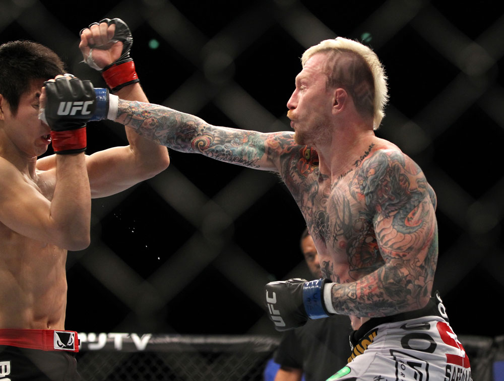 SAITAMA, JAPAN - FEBRUARY 26:  (R-L) Bart Palaszewski punches Hatsu Hioki during the UFC 144 event at Saitama Super Arena on February 26, 2012 in Saitama, Japan.  (Photo by Josh Hedges/Zuffa LLC/Zuffa LLC via Getty Images) *** Local Caption *** Hatsu Hioki; Bart Palaszewski