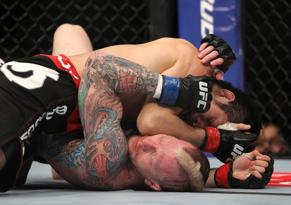 SAITAMA, JAPAN - FEBRUARY 26:  (R-L) Hatsu Hioki delivers an elbow strike against Bart Palaszewski during the UFC 144 event at Saitama Super Arena on February 26, 2012 in Saitama, Japan.  (Photo by Josh Hedges/Zuffa LLC/Zuffa LLC via Getty Images) *** Local Caption *** Hatsu Hioki; Bart Palaszewski