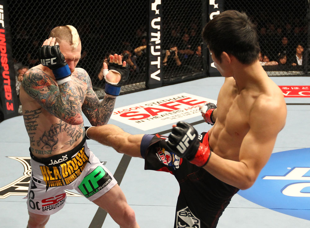 SAITAMA, JAPAN - FEBRUARY 26:  (R-L) Hatsu Hioki kicks Bart Palaszewski during the UFC 144 event at Saitama Super Arena on February 26, 2012 in Saitama, Japan.  (Photo by Al Bello/Zuffa LLC/Zuffa LLC via Getty Images) *** Local Caption *** Hatsu Hioki; Bart Palaszewski