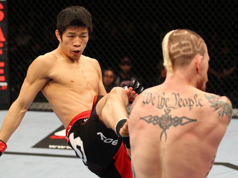 SAITAMA, JAPAN - FEBRUARY 26:  (L-R) Hatsu Hioki kicks Bart Palaszewski during the UFC 144 event at Saitama Super Arena on February 26, 2012 in Saitama, Japan.  (Photo by Al Bello/Zuffa LLC/Zuffa LLC via Getty Images) *** Local Caption *** Hatsu Hioki; Bart Palaszewski