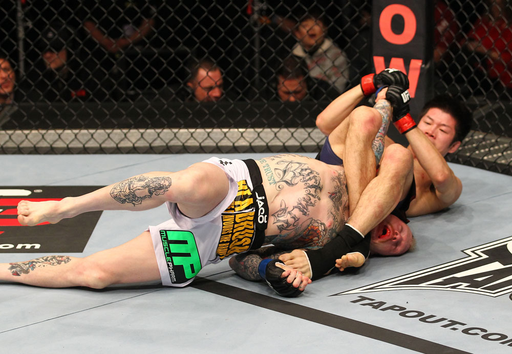 SAITAMA, JAPAN - FEBRUARY 26:  (R-L) Hatsu Hioki attempts an arm bar submission against Bart Palaszewski during the UFC 144 event at Saitama Super Arena on February 26, 2012 in Saitama, Japan.  (Photo by Al Bello/Zuffa LLC/Zuffa LLC via Getty Images) *** Local Caption *** Hatsu Hioki; Bart Palaszewski