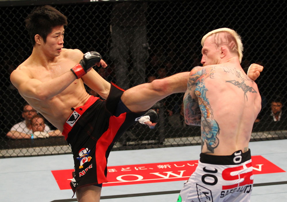 SAITAMA, JAPAN - FEBRUARY 26:  (L-R) Hatsu Hioki kicks Bart Palaszewski during the UFC 144 event at Saitama Super Arena on February 26, 2012 in Saitama, Japan.  (Photo by Al Bello/Zuffa LLC/Zuffa LLC via Getty Images) *** Local Caption *** Hatsu Hioki; Bart Palaszewski