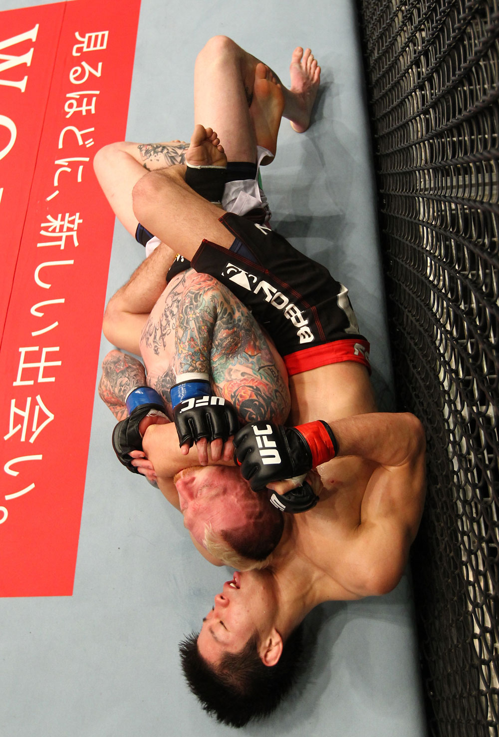 SAITAMA, JAPAN - FEBRUARY 26:  (R-L) Hatsu Hioki attempts to secure a submission hold against Bart Palaszewski during the UFC 144 event at Saitama Super Arena on February 26, 2012 in Saitama, Japan.  (Photo by Al Bello/Zuffa LLC/Zuffa LLC via Getty Images) *** Local Caption *** Hatsu Hioki; Bart Palaszewski