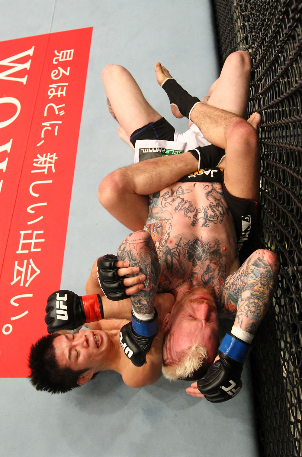 SAITAMA, JAPAN - FEBRUARY 26:  (L-R) Hatsu Hioki delivers an elbow strike against Bart Palaszewski during the UFC 144 event at Saitama Super Arena on February 26, 2012 in Saitama, Japan.  (Photo by Al Bello/Zuffa LLC/Zuffa LLC via Getty Images) *** Local Caption *** Hatsu Hioki; Bart Palaszewski