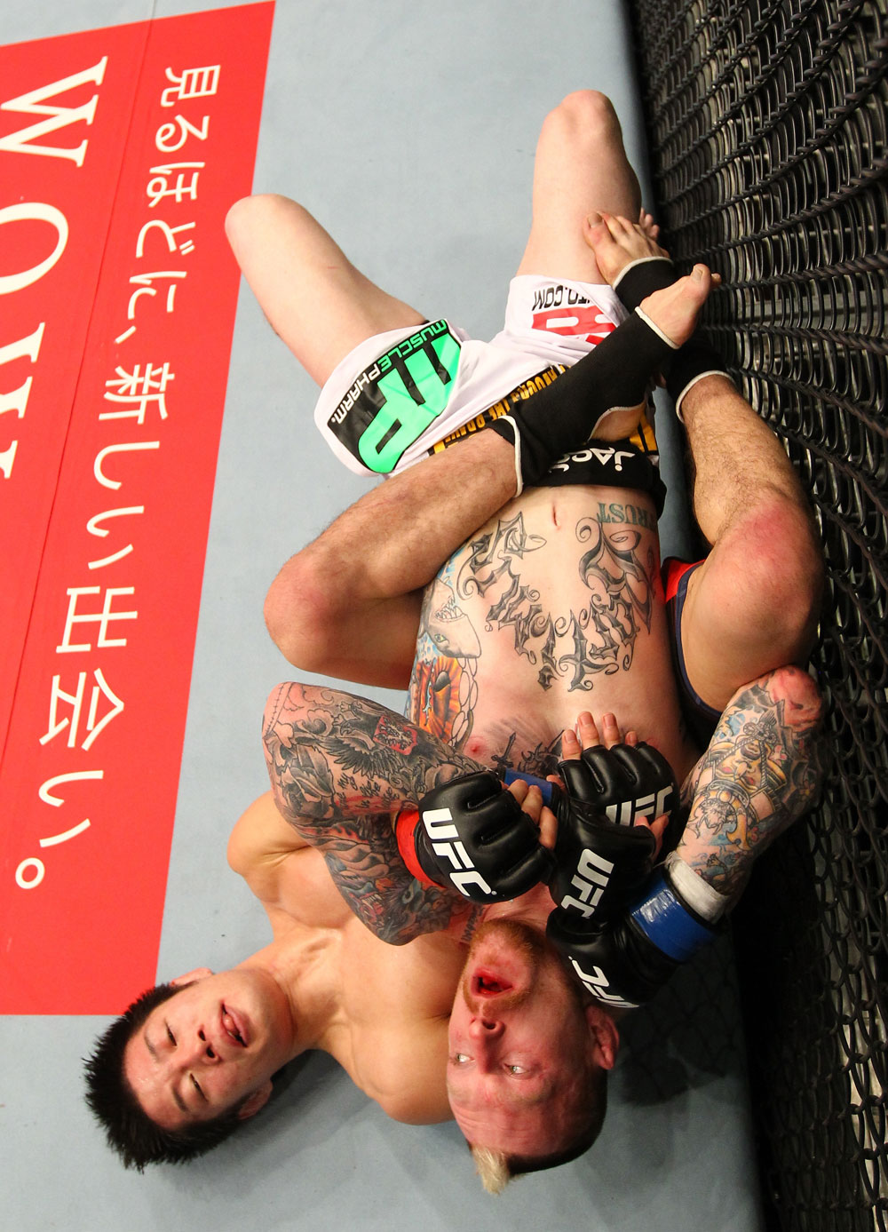 SAITAMA, JAPAN - FEBRUARY 26:  (L-R) Hatsu Hioki attempts to secure a submission hold against Bart Palaszewski during the UFC 144 event at Saitama Super Arena on February 26, 2012 in Saitama, Japan.  (Photo by Al Bello/Zuffa LLC/Zuffa LLC via Getty Images) *** Local Caption *** Hatsu Hioki; Bart Palaszewski