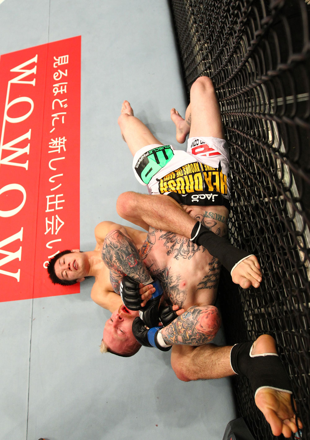SAITAMA, JAPAN - FEBRUARY 26:  (L-R) Hatsu Hioki attempts to secure a submission hold against Bart Palaszewski during the UFC 144 event at Saitama Super Arena on February 26, 2012 in Saitama, Japan.  (Photo by Al Bello/Zuffa LLC/Zuffa LLC via Getty Images) *** Local Caption *** Hatsu Hioki; Bart Palaszewski