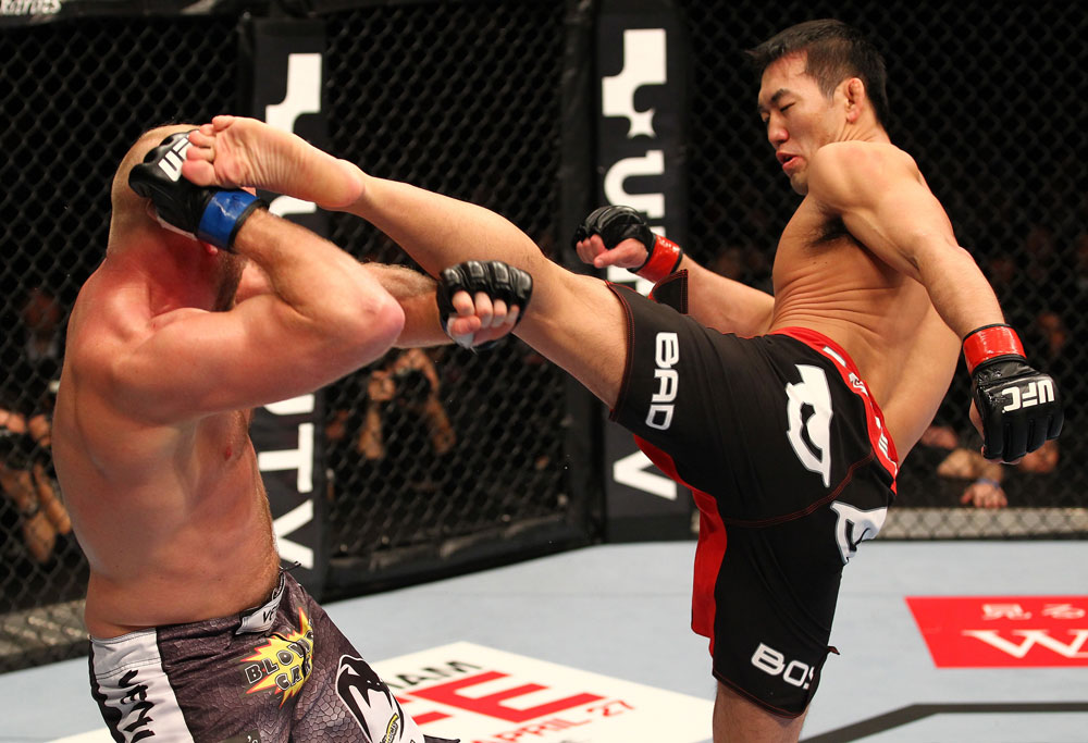 SAITAMA, JAPAN - FEBRUARY 26:  (R-L) Yushin Okami kicks Tim Boetsch during the UFC 144 event at Saitama Super Arena on February 26, 2012 in Saitama, Japan.  (Photo by Al Bello/Zuffa LLC/Zuffa LLC via Getty Images) *** Local Caption *** Yushin Okami; Tim Boetsch