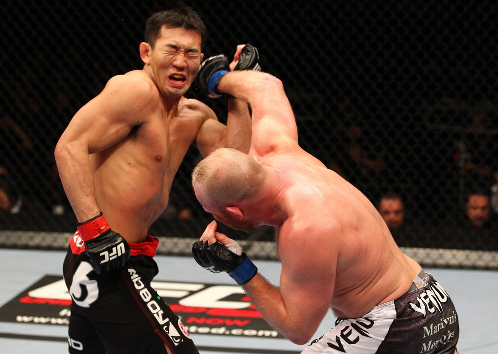 SAITAMA, JAPAN - FEBRUARY 26:  (R-L) Tim Boetsch punches Yushin Okami during the UFC 144 event at Saitama Super Arena on February 26, 2012 in Saitama, Japan.  (Photo by Al Bello/Zuffa LLC/Zuffa LLC via Getty Images) *** Local Caption *** Yushin Okami; Tim Boetsch