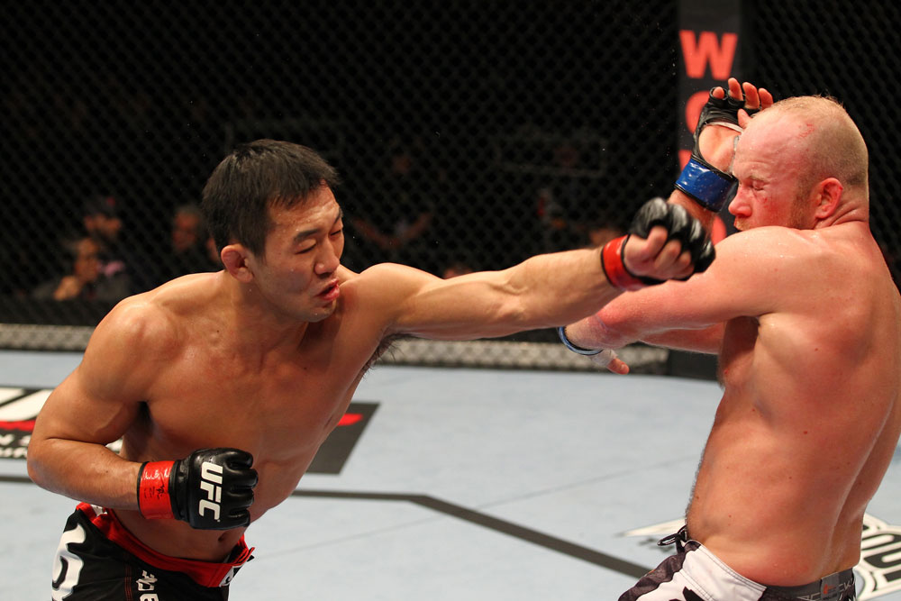 SAITAMA, JAPAN - FEBRUARY 26:  (L-R) Yushin Okami punches Tim Boetsch during the UFC 144 event at Saitama Super Arena on February 26, 2012 in Saitama, Japan.  (Photo by Al Bello/Zuffa LLC/Zuffa LLC via Getty Images) *** Local Caption *** Yushin Okami; Tim Boetsch