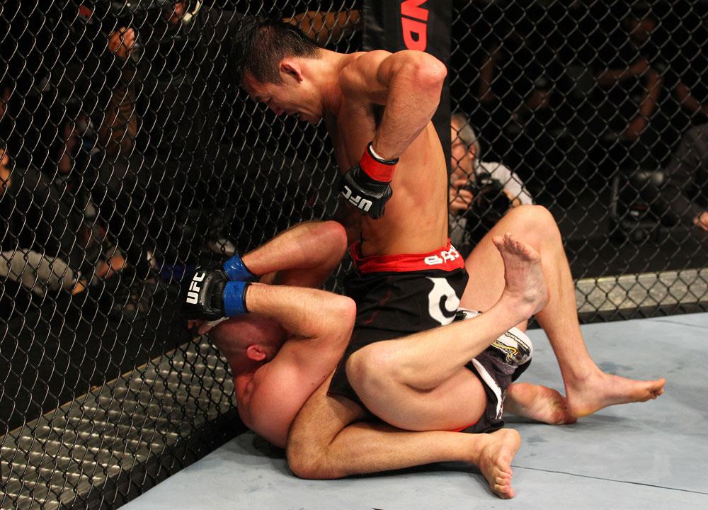 SAITAMA, JAPAN - FEBRUARY 26:  (R-L) Yushin Okami punches Tim Boetsch during the UFC 144 event at Saitama Super Arena on February 26, 2012 in Saitama, Japan.  (Photo by Al Bello/Zuffa LLC/Zuffa LLC via Getty Images) *** Local Caption *** Yushin Okami; Tim Boetsch