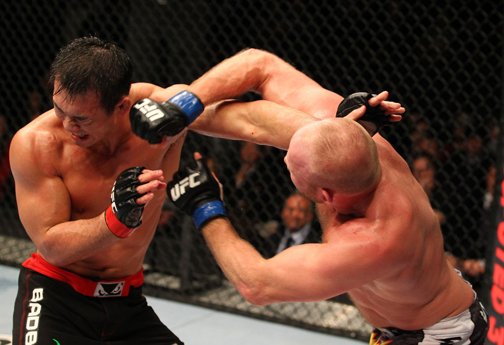SAITAMA, JAPAN - FEBRUARY 26:  (R-L) Tim Boetsch punches Yushin Okami during the UFC 144 event at Saitama Super Arena on February 26, 2012 in Saitama, Japan.  (Photo by Al Bello/Zuffa LLC/Zuffa LLC via Getty Images) *** Local Caption *** Yushin Okami; Tim Boetsch