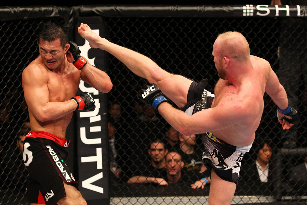 SAITAMA, JAPAN - FEBRUARY 26:  (R-L) Tim Boetsch kicks Yushin Okami during the UFC 144 event at Saitama Super Arena on February 26, 2012 in Saitama, Japan.  (Photo by Al Bello/Zuffa LLC/Zuffa LLC via Getty Images) *** Local Caption *** Yushin Okami; Tim Boetsch
