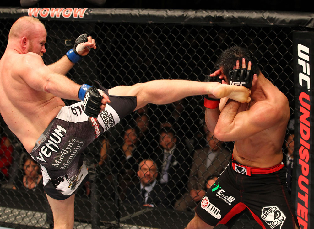 SAITAMA, JAPAN - FEBRUARY 26:  (L-R) Tim Boetsch kicks Yushin Okami during the UFC 144 event at Saitama Super Arena on February 26, 2012 in Saitama, Japan.  (Photo by Al Bello/Zuffa LLC/Zuffa LLC via Getty Images) *** Local Caption *** Yushin Okami; Tim Boetsch