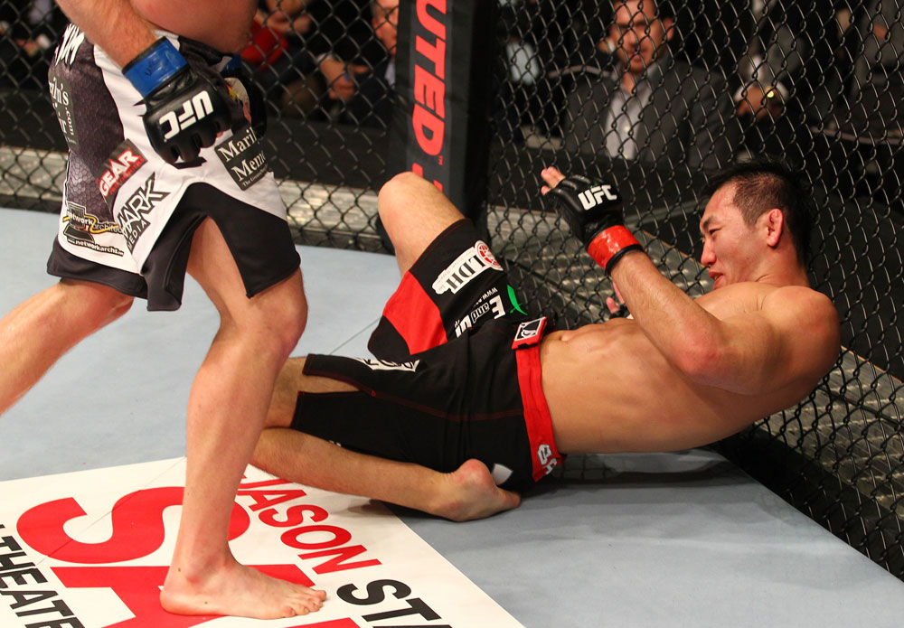 SAITAMA, JAPAN - FEBRUARY 26:  Yushin Okami lies on the canvas after being knocked down by a punch from Tim Boetsch during the UFC 144 event at Saitama Super Arena on February 26, 2012 in Saitama, Japan.  (Photo by Al Bello/Zuffa LLC/Zuffa LLC via Getty Images) *** Local Caption *** Yushin Okami; Tim Boetsch