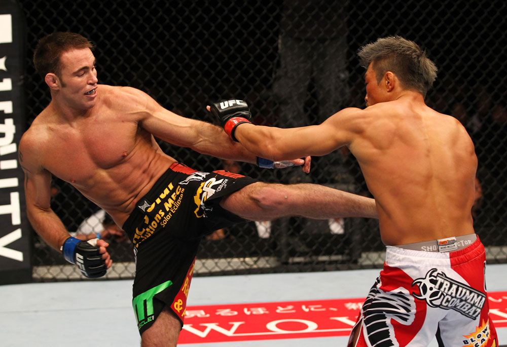 SAITAMA, JAPAN - FEBRUARY 26:  (L-R) Jake Shields kicks Yoshihiro Akiyama during the UFC 144 event at Saitama Super Arena on February 26, 2012 in Saitama, Japan.  (Photo by Al Bello/Zuffa LLC/Zuffa LLC via Getty Images) *** Local Caption *** Yoshihiro Akiyama; Jake Shields