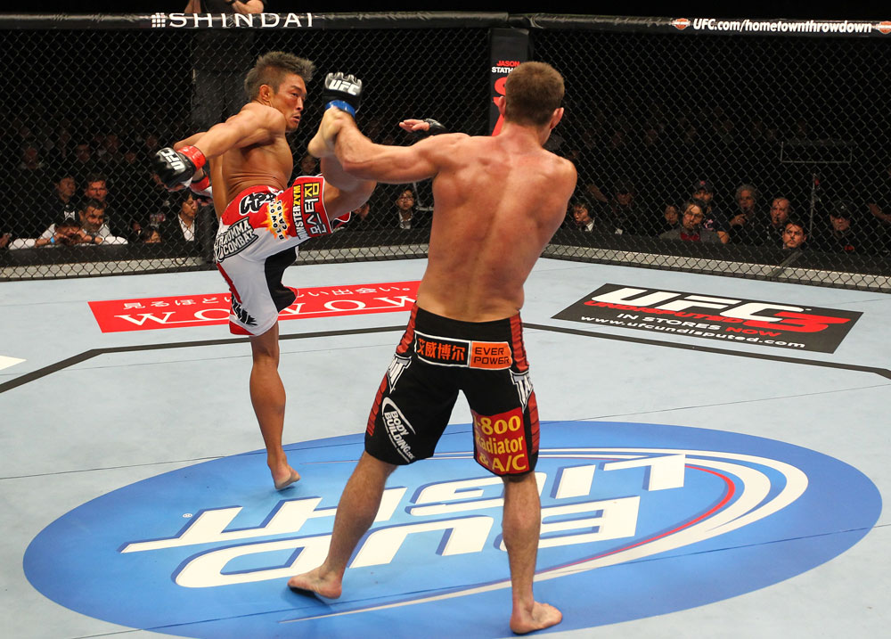 SAITAMA, JAPAN - FEBRUARY 26:  (L-R) Yoshihiro Akiyama kicks Jake Shields during the UFC 144 event at Saitama Super Arena on February 26, 2012 in Saitama, Japan.  (Photo by Al Bello/Zuffa LLC/Zuffa LLC via Getty Images) *** Local Caption *** Yoshihiro Akiyama; Jake Shields