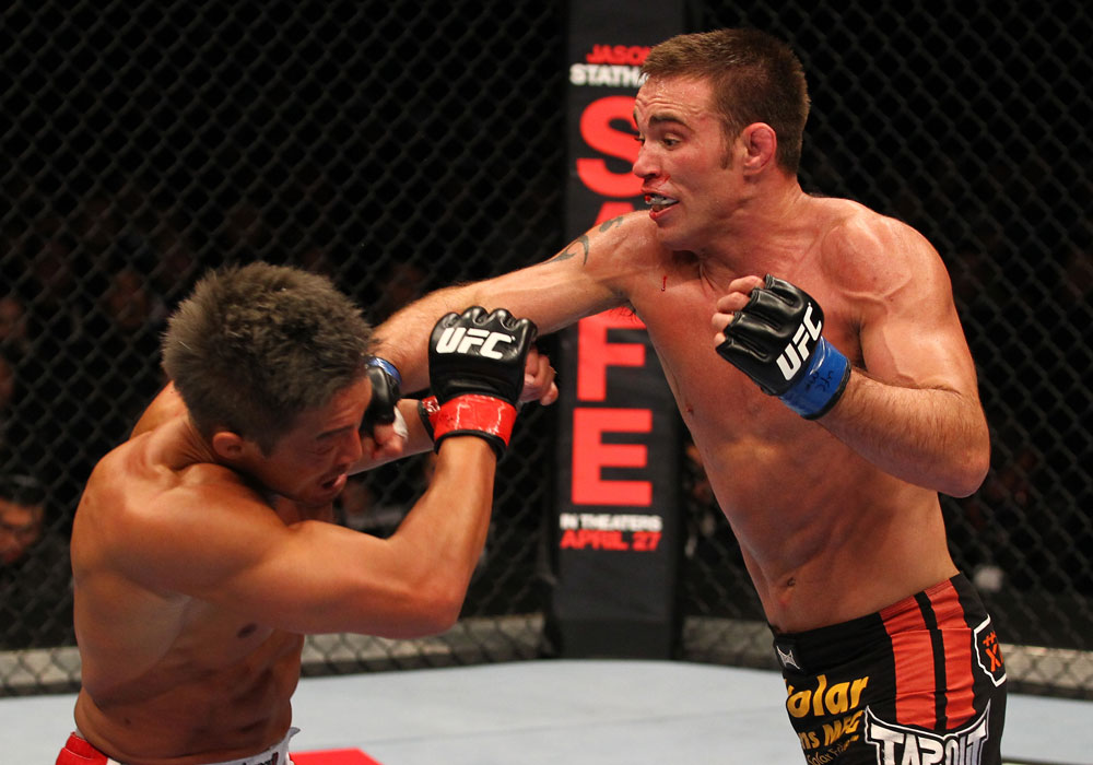SAITAMA, JAPAN - FEBRUARY 26:  (R-L) Jake Shields punches Yoshihiro Akiyama during the UFC 144 event at Saitama Super Arena on February 26, 2012 in Saitama, Japan.  (Photo by Al Bello/Zuffa LLC/Zuffa LLC via Getty Images) *** Local Caption *** Yoshihiro Akiyama; Jake Shields