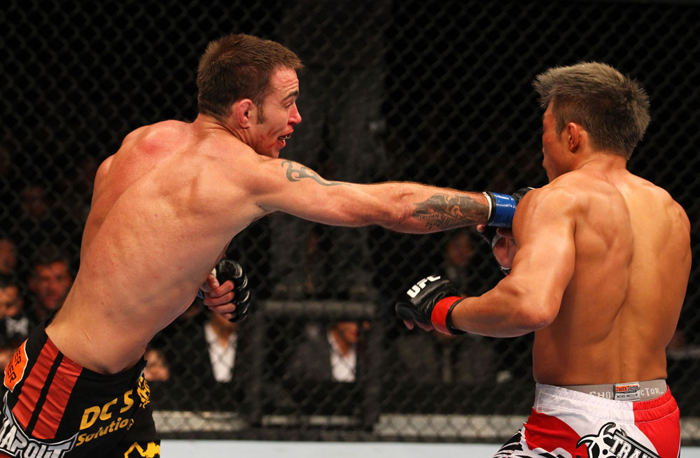 SAITAMA, JAPAN - FEBRUARY 26:  (L-R) Jake Shields punches Yoshihiro Akiyama during the UFC 144 event at Saitama Super Arena on February 26, 2012 in Saitama, Japan.  (Photo by Al Bello/Zuffa LLC/Zuffa LLC via Getty Images) *** Local Caption *** Yoshihiro Akiyama; Jake Shields