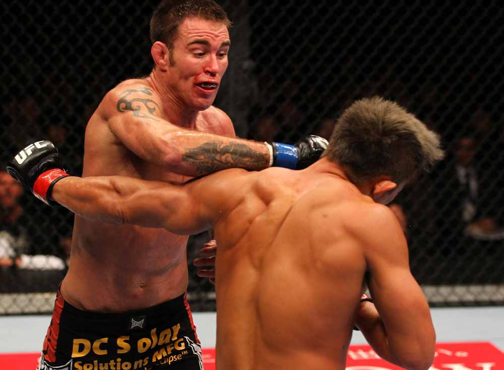 SAITAMA, JAPAN - FEBRUARY 26:  (L-R) Jake Shields punches Yoshihiro Akiyama during the UFC 144 event at Saitama Super Arena on February 26, 2012 in Saitama, Japan.  (Photo by Al Bello/Zuffa LLC/Zuffa LLC via Getty Images) *** Local Caption *** Yoshihiro Akiyama; Jake Shields