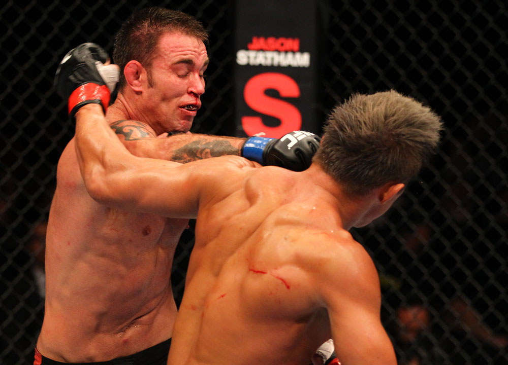 SAITAMA, JAPAN - FEBRUARY 26:  (L-R) Jake Shields punches Yoshihiro Akiyama during the UFC 144 event at Saitama Super Arena on February 26, 2012 in Saitama, Japan.  (Photo by Al Bello/Zuffa LLC/Zuffa LLC via Getty Images) *** Local Caption *** Yoshihiro Akiyama; Jake Shields