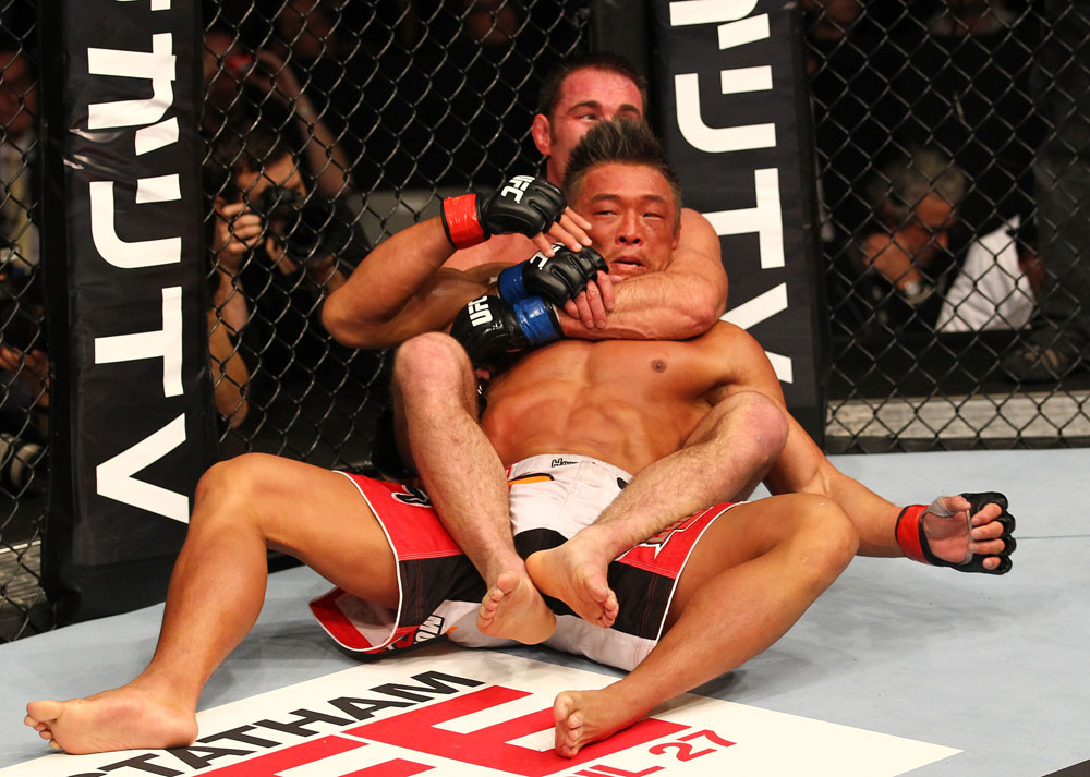 SAITAMA, JAPAN - FEBRUARY 26:  (L-R) Jake Shields attempts a rear choke submission against Yoshihiro Akiyama during the UFC 144 event at Saitama Super Arena on February 26, 2012 in Saitama, Japan.  (Photo by Al Bello/Zuffa LLC/Zuffa LLC via Getty Images) *** Local Caption *** Yoshihiro Akiyama; Jake Shields