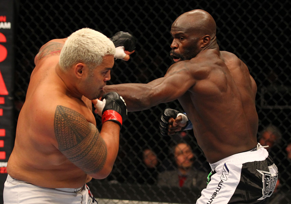 SAITAMA, JAPAN - FEBRUARY 26:  (R-L) Cheick Kongo punches Mark Hunt during the UFC 144 event at Saitama Super Arena on February 26, 2012 in Saitama, Japan.  (Photo by Al Bello/Zuffa LLC/Zuffa LLC via Getty Images) *** Local Caption *** Mark Hunt; Cheick Kongo