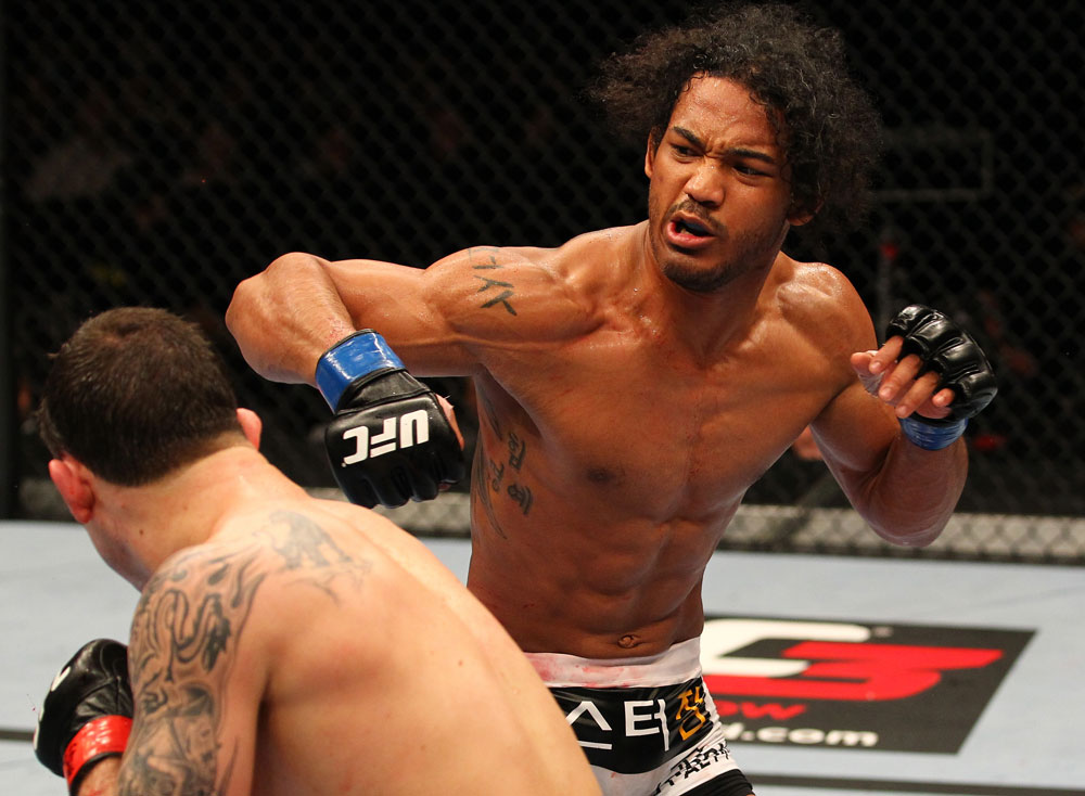 SAITAMA, JAPAN - FEBRUARY 26:  (R-L) Benson Henderson punches Frankie Edgar during the UFC 144 event at Saitama Super Arena on February 26, 2012 in Saitama, Japan.  (Photo by Al Bello/Zuffa LLC/Zuffa LLC via Getty Images) *** Local Caption *** Frankie Edgar; Benson Henderson