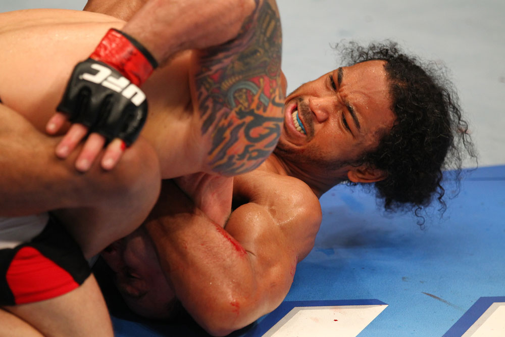 SAITAMA, JAPAN - FEBRUARY 26:  (R-L) Benson Henderson attempts a guillotine choke against Frankie Edgar during the UFC 144 event at Saitama Super Arena on February 26, 2012 in Saitama, Japan.  (Photo by Al Bello/Zuffa LLC/Zuffa LLC via Getty Images) *** Local Caption *** Frankie Edgar; Benson Henderson