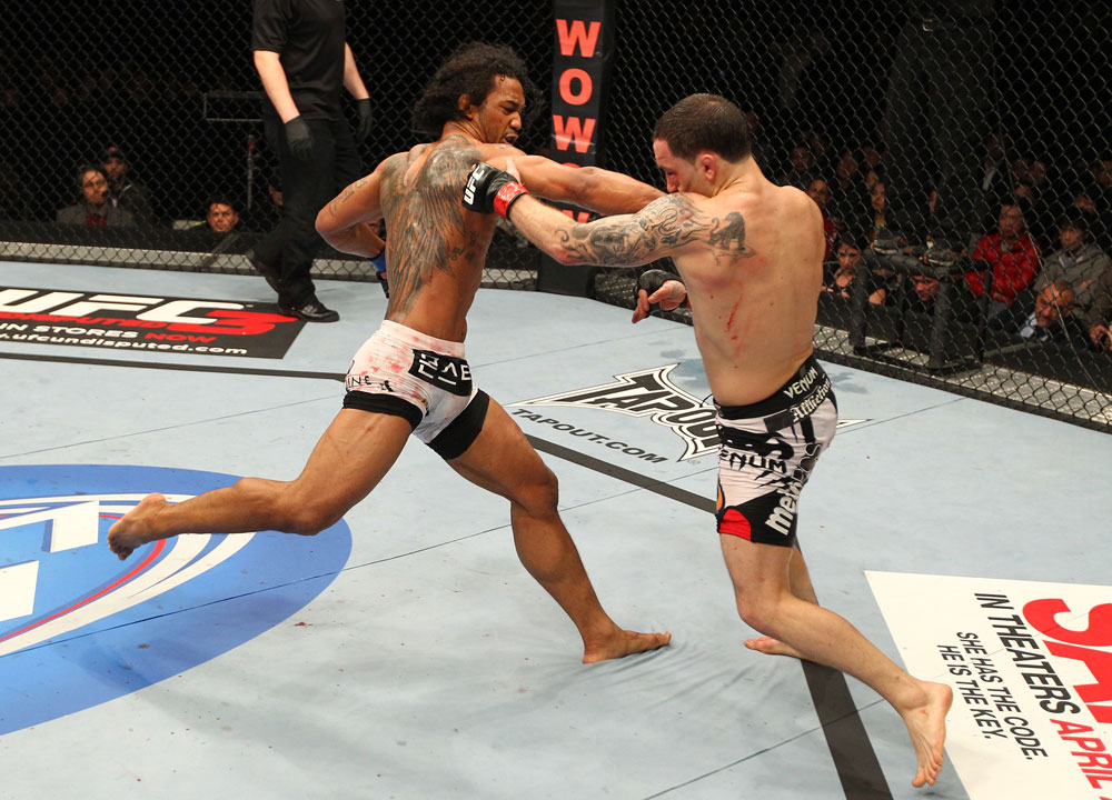SAITAMA, JAPAN - FEBRUARY 26:  (L-R) Benson Henderson punches Frankie Edgar during the UFC 144 event at Saitama Super Arena on February 26, 2012 in Saitama, Japan.  (Photo by Al Bello/Zuffa LLC/Zuffa LLC via Getty Images) *** Local Caption *** Frankie Edgar; Benson Henderson