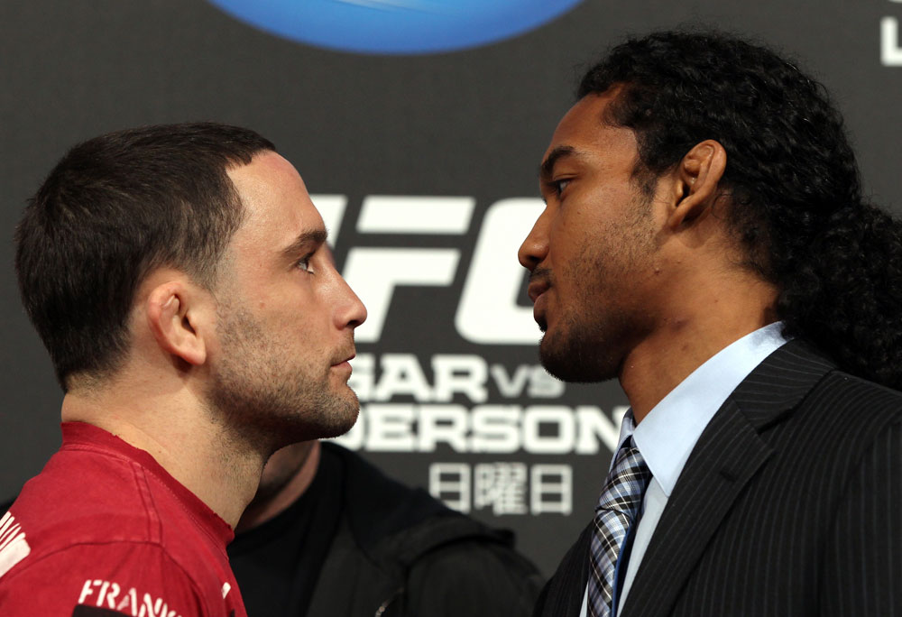 TOKYO, JAPAN - FEBRUARY 23: (L-R) UFC Lightweight Champion Frankie Edgar and challenger Benson Henderson face off at the final UFC 144 pre-fight press conference at the Ritz-Carlton Hotel on February 23, 2012 in Tokyo, Japan. (Photo by Josh Hedges/Zuffa LLC/Zuffa LLC via Getty Images) *** Local Caption *** Frankie Edgar; Benson Henderson