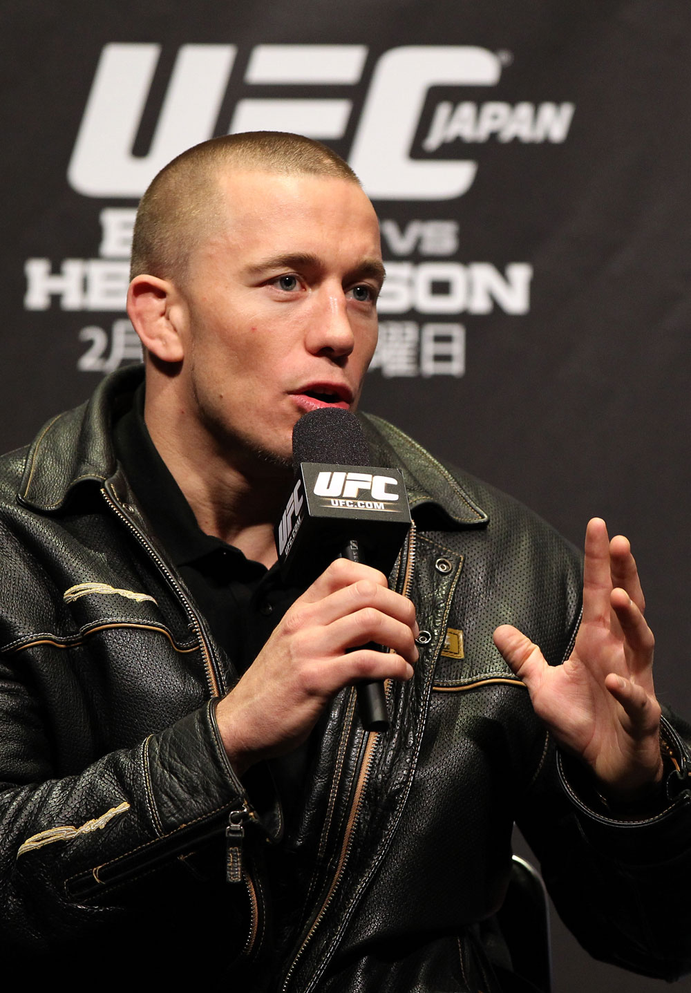 SAITAMA, JAPAN - FEBRUARY 25: UFC Welterweight Champion Georges St-Pierre takes part in a Q&A session before the official UFC 144 weigh in at the Saitama Super Arena on February 25, 2012 in Saitama, Japan. (Photo by Josh Hedges/Zuffa LLC/Zuffa LLC via Getty Images) *** Local Caption *** Georges St-Pierre