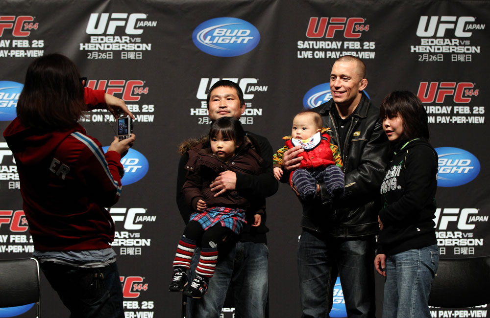 SAITAMA, JAPAN - FEBRUARY 25: UFC Welterweight Champion Georges St-Pierre poses for photos with fans before the official UFC 144 weigh in at the Saitama Super Arena on February 25, 2012 in Saitama, Japan. (Photo by Josh Hedges/Zuffa LLC/Zuffa LLC via Getty Images) *** Local Caption *** Georges St-Pierre