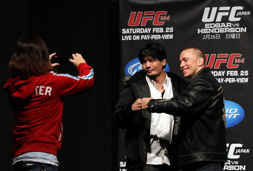 SAITAMA, JAPAN - FEBRUARY 25: UFC Welterweight Champion Georges St-Pierre poses for photos with fans before the official UFC 144 weigh in at the Saitama Super Arena on February 25, 2012 in Saitama, Japan. (Photo by Josh Hedges/Zuffa LLC/Zuffa LLC via Getty Images) *** Local Caption *** Georges St-Pierre