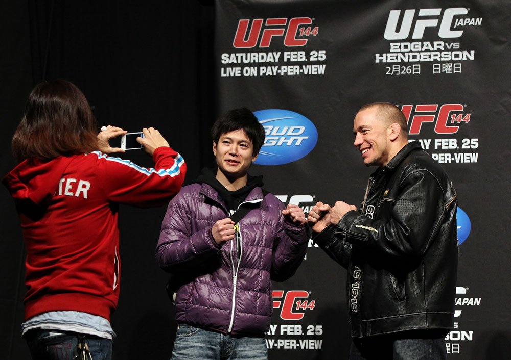 SAITAMA, JAPAN - FEBRUARY 25: UFC Welterweight Champion Georges St-Pierre poses for photos with fans before the official UFC 144 weigh in at the Saitama Super Arena on February 25, 2012 in Saitama, Japan. (Photo by Josh Hedges/Zuffa LLC/Zuffa LLC via Getty Images) *** Local Caption *** Georges St-Pierre