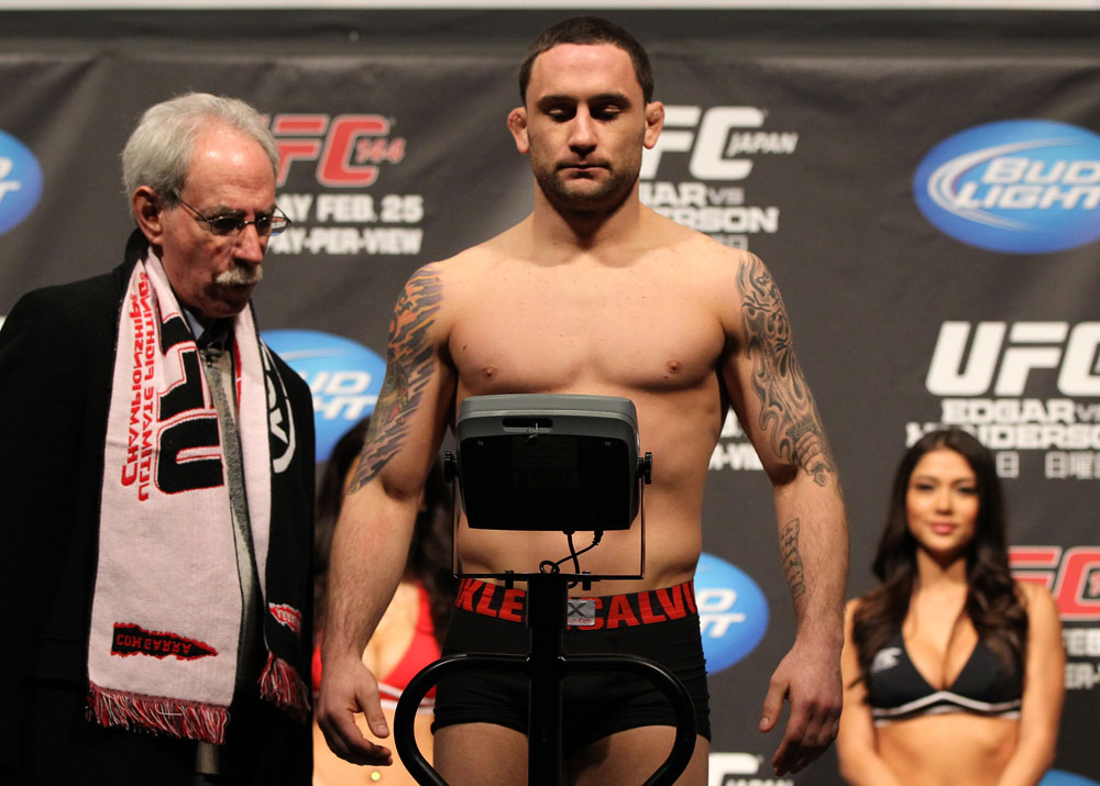 SAITAMA, JAPAN - FEBRUARY 25: UFC Lightweight Champion Frankie Edgar weighs in during the official UFC 144 weigh in at the Saitama Super Arena on February 25, 2012 in Saitama, Japan. (Photo by Josh Hedges/Zuffa LLC/Zuffa LLC via Getty Images) *** Local Caption *** Frankie Edgar